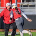 Kendall Poe, seen congratulating Madison Mize after Mize homered against Gloencoe on March 12, will add varsity girls’ basketball to her coaching responsibilities. (Photo by Brad Campbell/sport-shutter.com)