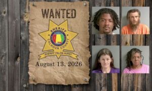 Wanted photo with 4 mugshots on old west wood planked wall with wanted poster and Sheriff's Office star