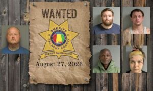 Wanted photo with 5 mugshots on old west wood planked wall with wanted poster and Sheriff's Office star