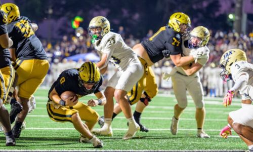 Oxford quarterback Maddox Mims eyes the goal line against Jacksonville on Friday on Lamar Field. (Photo by Joe Medley/sport-shutter.com)