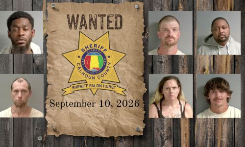 Wanted photo with 6 mugshots on old west wood planked wall with wanted poster and Sheriff's Office star