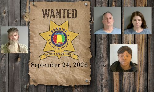 Wanted photo with 4 mugshots on old west wood planked wall with wanted poster and Sheriff's Office star