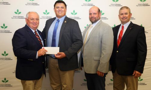 Calhoun County native and Auburn University student Jackson Cleary received a $2,000 scholarship from the Alabama Farmers Agriculture Foundation and the Calhoun County Farmers Federation (CCFF). Cleary was recognized during the Alabama Farmers Federation scholarship reception Sept. 21 at Lazenby Farms in Auburn. Cleary is a senior studying agriscience education. From left are Federation President Jimmy Parnell, Cleary, CCFF board member and Federation Central Area Vice President Jon Hegeman, and Federation District 6 Director Phillip Hunter.