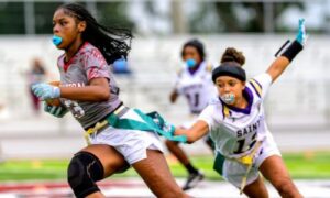 Anniston’s Kamryn Harris (3) runs as Hope Christian’s Kiyra Butler reaches for her flag during their game at Anniston High School on Monday. (Photo by Brad Campbell/sport-shutter.com)