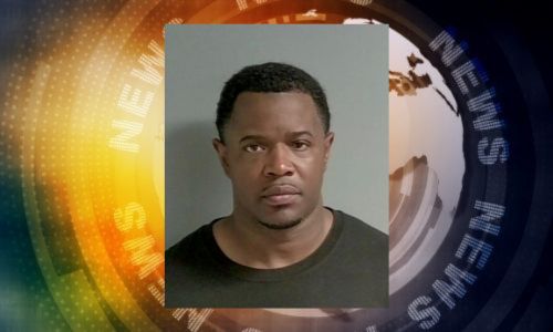 Photo of black male on background of News written in circle